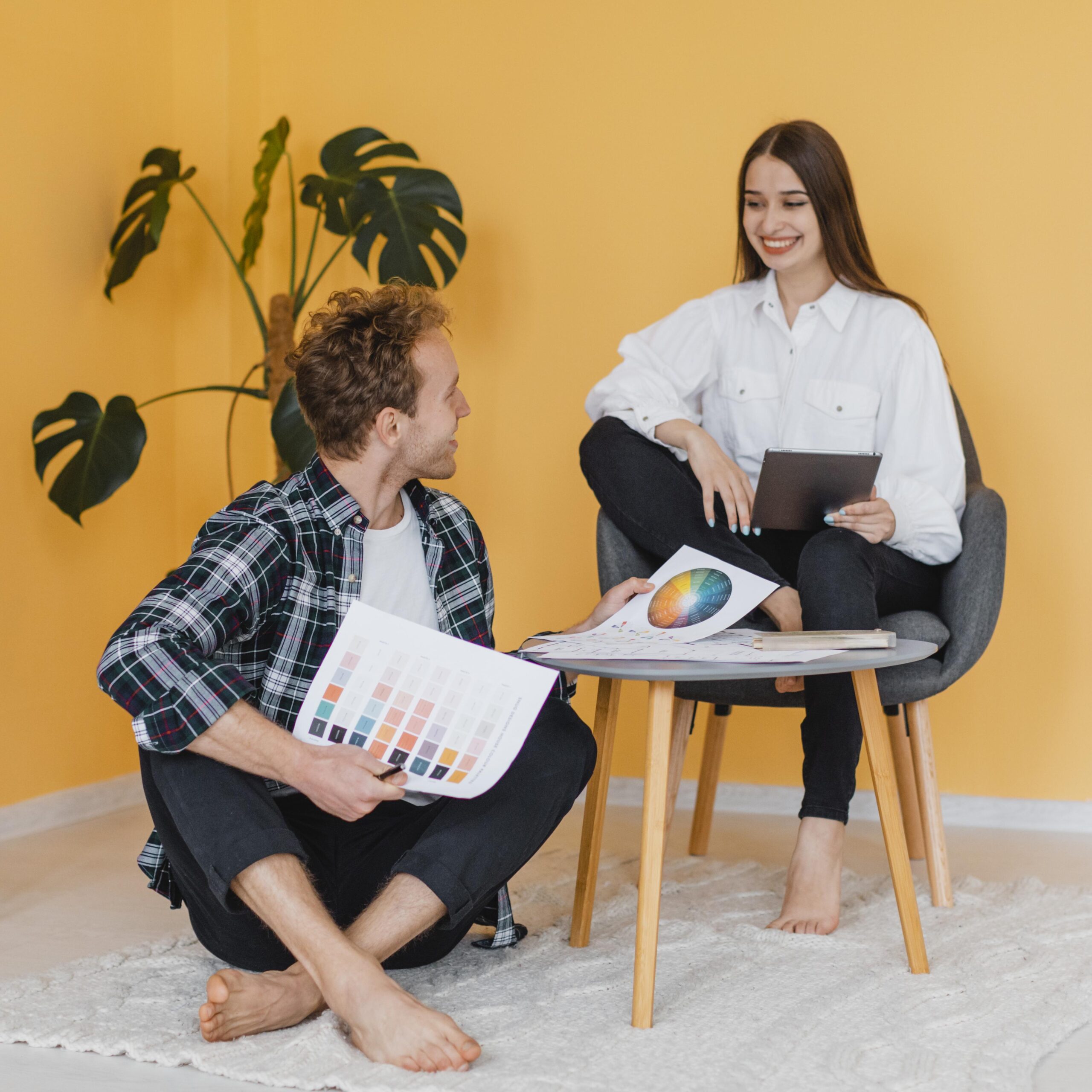 smiley-couple-making-plans-redecorate-home